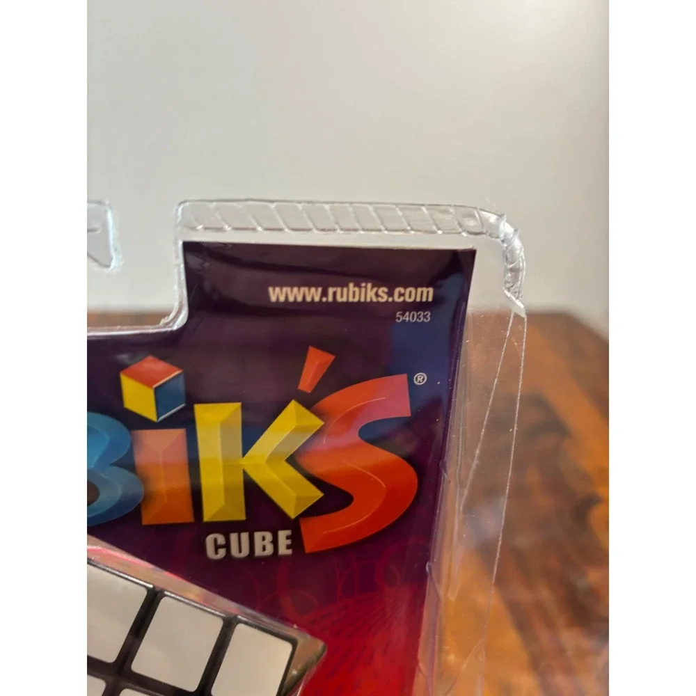 Milton Bradley Rubiks Cube 3x3 Puzzle with Stand and Booklet 54033 New Sealed